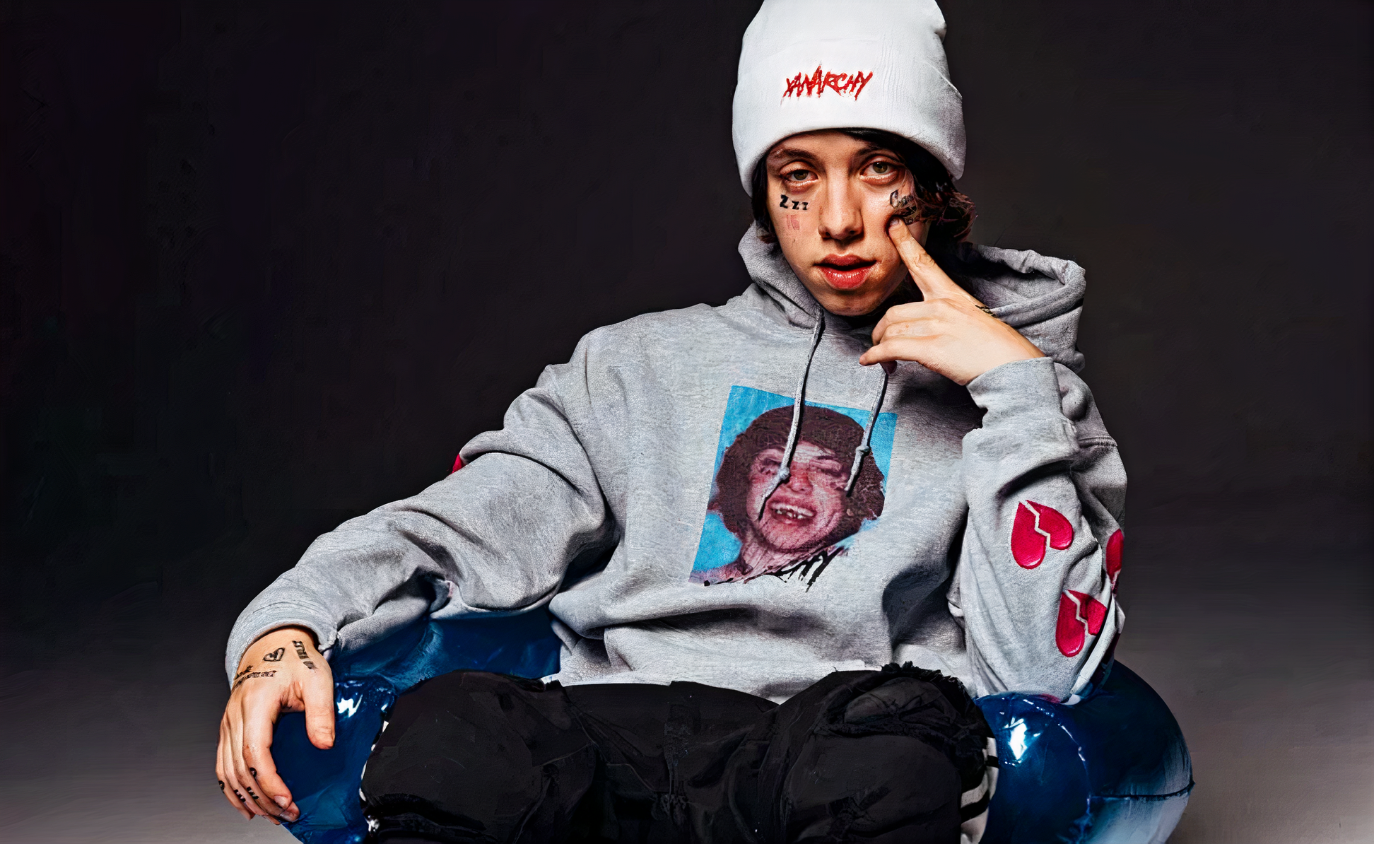 Rapper Lil Xan co-signing Focus Rich Clothing, highlighting the brand's connection with new wave hip-hop culture.
